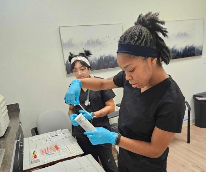 students working with medical assisting tools