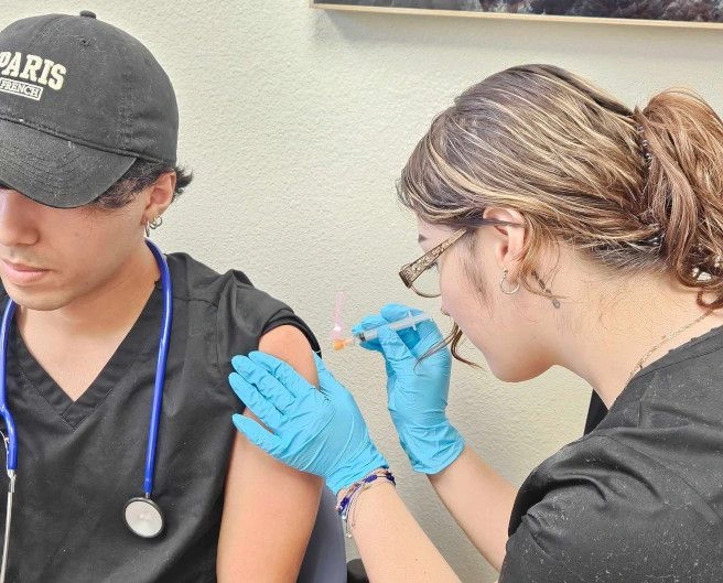 students training to administer injection